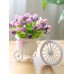 أزهار صناعية زخرفية للمنزل جميلة وطازجة مع سلّة حفظ شكل دراجة