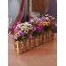 أزهار إصطناعية زخرفية للمنزل مع سياج خشبي