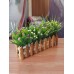 أزهار إصطناعية زخرفية للمنزل مع سياج خشبي
